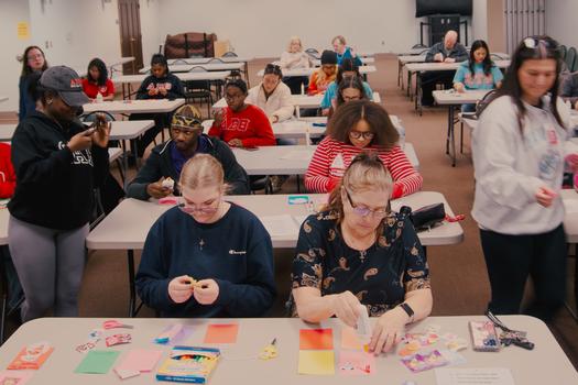 Participants work on Valentine's Day cards at the Jacksonville Public Library