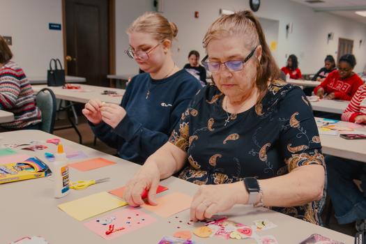 Participants work on Valentine's Day cards at the Jacksonville Public Library