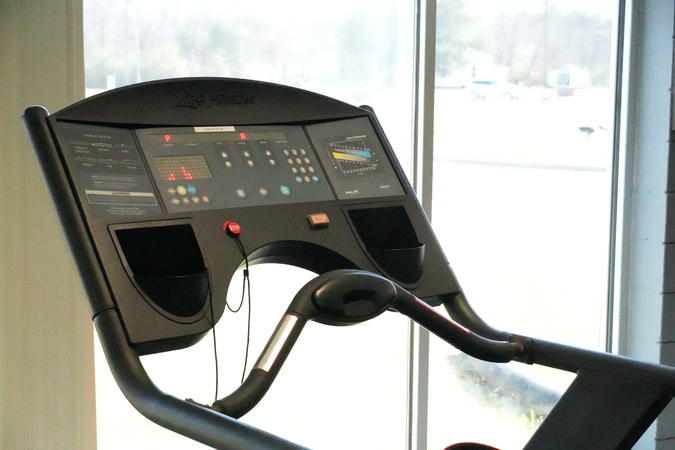 A treadmill settings panel in the fitness room.
